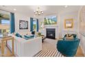 Cozy living room features a fireplace, plush seating, and plenty of natural light at 148 Sugar Pine Drive, Franklinton, NC 27525