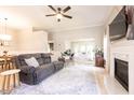 Inviting living room with fireplace, wood floors, and neutral decor offers a comfortable living space at 1816 Piperwood Ct, Durham, NC 27713