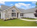 Attractive front of house with stone details and landscaped garden at 1969 Bowles Ave, Creedmoor, NC 27522