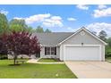 Beautiful single Gathering home with manicured lawn and stone accents at 1969 Bowles Ave, Creedmoor, NC 27522
