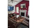 Cozy living room boasts a fireplace, vaulted ceilings, and natural light at 2122 Sterling Creek Ln, Franklinton, NC 27525