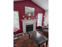 Bright living room with fireplace and neutral toned furniture at 2122 Sterling Creek Ln, Franklinton, NC 27525