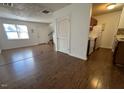 Open-concept living space featuring hardwood floors, access to kitchen and staircase to bedrooms at 2146 Charles St # 12, Durham, NC 27707
