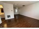 Spacious living room featuring hardwood floors and a view into the bathroom and additional rooms at 2146 Charles St # 12, Durham, NC 27707
