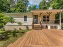 Spacious wooden deck with multiple levels, perfect for outdoor entertaining and relaxation at 280 Sagamore Dr, Louisburg, NC 27549