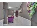 Inviting foyer with marble floors, decorative mirrors and dark colored walls at 3019 Britmass Dr, Raleigh, NC 27616