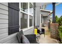 Inviting porch features outdoor seating and views of the surrounding neighborhood at 34 Schoolhouse Way, Clayton, NC 27520