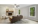 Inviting living room with a brick fireplace, ceiling fan, and large windows at 3420 Greenville Loop Rd, Wake Forest, NC 27587