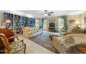 Cozy living room with built-in bookshelves, plush seating, and ample natural light at 4 Barkridge Ct, Durham, NC 27713