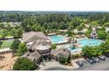 A stunning aerial view of the community pool, clubhouse and surrounding landscape at 4003 Jockey Club Cir, Cary, NC 27519