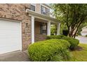 Inviting front porch with white columns and well-maintained landscaping at 4003 Jockey Club Cir, Cary, NC 27519