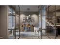 Stylish home office featuring modern desk, glass walls, and ample natural light at 404 Shinleaf Pond Trl, Raleigh, NC 27614