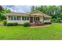 Charming single-story home with a covered front porch and well-manicured lawn at 41 Maple Cir, Pittsboro, NC 27312