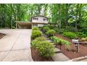 Charming two-story home with landscaped front yard and steps leading to the front door at 4213 Oak Park Rd, Raleigh, NC 27612