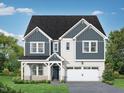 Charming two-story home with blue and white siding, well-manicured lawn, and a two-car garage at 452 Golden Dragonfly St, Wake Forest, NC 27587