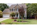 Attractive two-story home with manicured front lawn and traditional architectural design at 5305 Balmy Dawn Ct, Raleigh, NC 27613