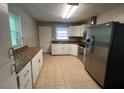 Bright kitchen with stainless steel appliances and plenty of counter space at 727 Queens Ave, Dunn, NC 28334