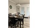 Cozy dining area with a table set for four and filled with natural light at 940 Pamela Ln, Rocky Mount, NC 27803