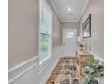 Bright hallway features natural light, fresh paint, and a decor table at 1022 Flagler St, Durham, NC 27713