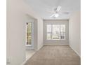 Cozy living room with lots of natural light coming from two windows and a door at 11340 Involute Pl # 100, Raleigh, NC 27617