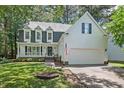 Beautiful home exterior with dormer windows and a two-car garage at 115 Nuttree Way, Durham, NC 27713