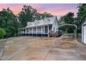 Charming home with a metal roof, covered porch, and covered parking area, ideal for a rural lifestyle at 1408 Old Ivey Rd, Apex, NC 27523