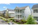 Charming two-story home with a double front porch situated in a quiet neighborhood at 1423 Tannin Dr, Durham, NC 27713
