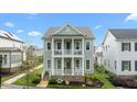 Stunning two-story home boasting double porches and beautiful landscaping in a desirable neighborhood at 1423 Tannin Dr, Durham, NC 27713