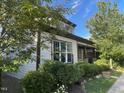A beautiful home exterior showcasing its well-maintained siding, manicured landscaping, and architectural details at 1930 Briar Chapel Pkwy, Chapel Hill, NC 27516