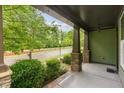 Inviting front porch featuring stone pillars and a view of the street at 1930 Briar Chapel Pkwy, Chapel Hill, NC 27516