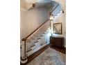 Elegant staircase featuring dark wood treads and white risers at 1930 Reid St, Raleigh, NC 27608
