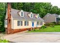 Well-maintained home with updated siding and a brick chimney at 210 Dutchess Dr, Cary, NC 27513