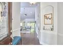 Bright foyer featuring hardwood floors, high ceilings, and an open view to the living area at 2916 Reynolda Cir, Durham, NC 27712