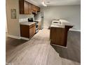 Kitchen featuring updated cabinets, stainless steel appliances, granite countertops, and new floors at 3047 Huntleigh Dr, Raleigh, NC 27604