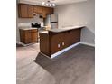 Kitchen featuring updated cabinets, stainless steel appliances, granite countertops, and new floors at 3047 Huntleigh Dr, Raleigh, NC 27604