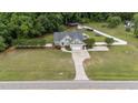 Expansive aerial view of home showcasing large lot, swimming pool, long driveway and backyard at 3216 Nc Hwy 42, Willow Springs, NC 27592