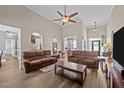 Open-concept living room with high ceilings, hardwood floors, and arched doorway at 3216 Nc Hwy 42, Willow Springs, NC 27592