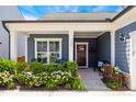 Inviting front porch with seating, flowers, and classic details creating a warm, welcoming entrance at 3309 Turner Ridge Dr, New Hill, NC 27562