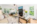 Bright and airy living room with a decorative fireplace and hardwood floors at 3401 Sitzman Ct, Raleigh, NC 27616
