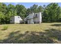 Spacious backyard with a deck, balcony, and separate garage at 3504 Lexham Ct, Apex, NC 27539