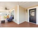 Inviting covered front porch with a comfortable seating area and a view of the neighborhood at 405 Challenge Rd, Raleigh, NC 27603