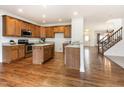 Updated kitchen with stainless steel appliances, granite countertops, and custom cabinetry at 405 Challenge Rd, Raleigh, NC 27603