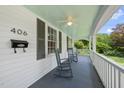 Inviting front porch with rocking chairs, offering a relaxing space with classic charm and curb appeal at 406 E Lee St, Smithfield, NC 27577