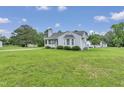 Inviting home with a large, grassy front yard, perfect for outdoor activities and curb appeal at 5849 Rocking Chair Dr, Youngsville, NC 27596