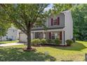 Two-story home with a garage and manicured lawn at 5940 Brambleton Ave, Raleigh, NC 27610