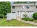 Charming townhouse with a white picket fence and landscaped front yard at 7315 Sandy Creek Dr # 7, Raleigh, NC 27615