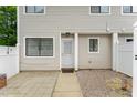 Inviting townhouse entrance featuring a secure screen door and well-maintained walkway at 7315 Sandy Creek Dr # 7, Raleigh, NC 27615