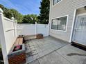 Serene outdoor patio area with a wooden bench and charming flower boxes at 7315 Sandy Creek Dr # 7, Raleigh, NC 27615