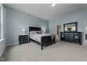 Serene bedroom with a comfortable bed, soft lighting, and a calming color palette at 763 Blossom Grove Dr, Cary, NC 27519