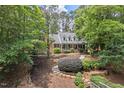 Beautiful two-story home featuring a covered front porch and well-maintained landscaping at 9900 Two Robins Ct, Raleigh, NC 27613